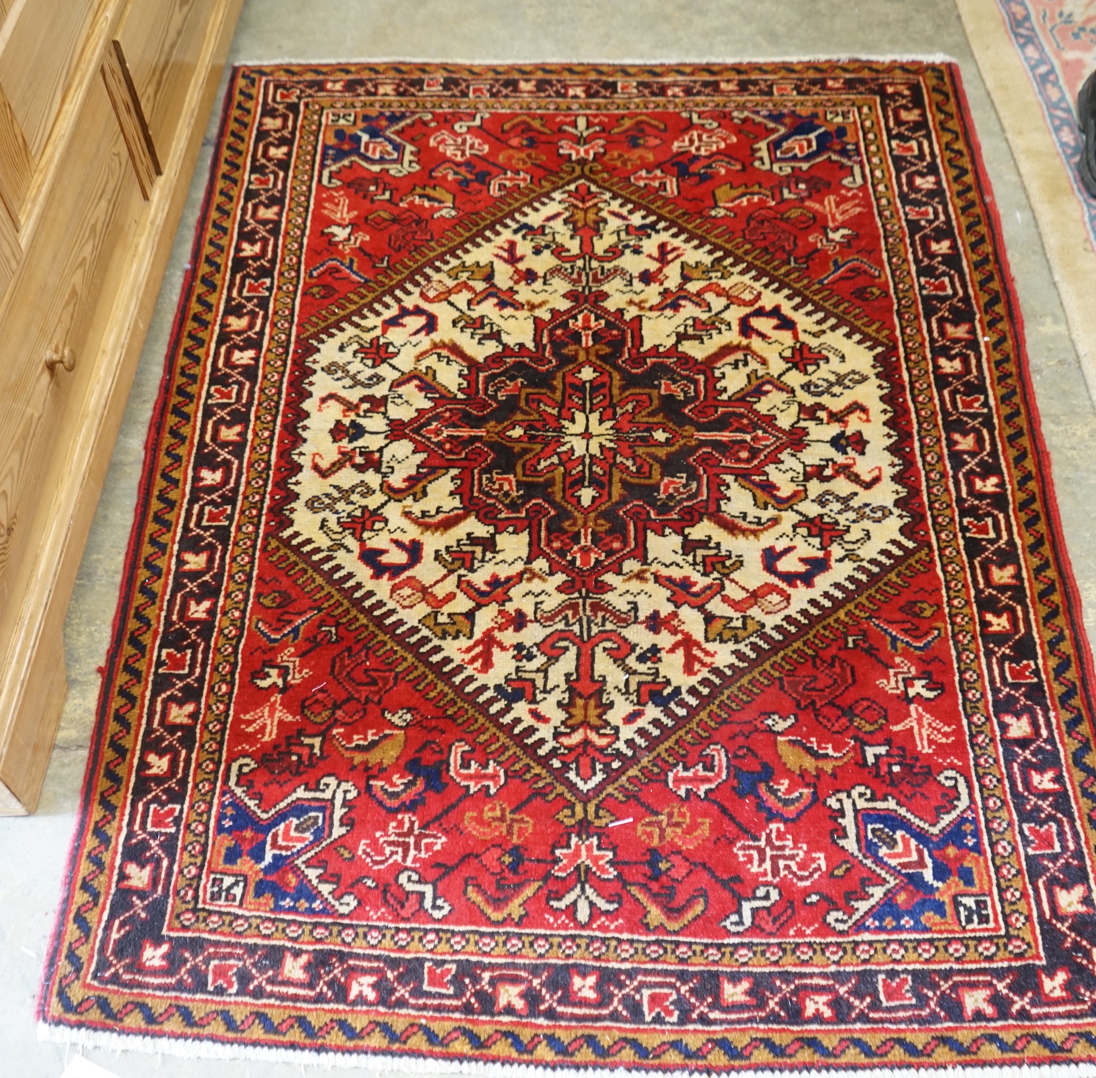 A Heriz ivory ground rug, 148 x 110cm